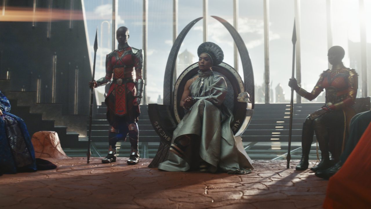 (L-R): Dorothy Steel as Merchant Tribe Elder, Florence Kasumba as Ayo, Angela Bassett as Ramonda, Danai Gurira as Okoye in Marvel Studios' Black Panther: Wakanda Forever. Photo courtesy of Marvel Studios. © 2022 MARVEL.