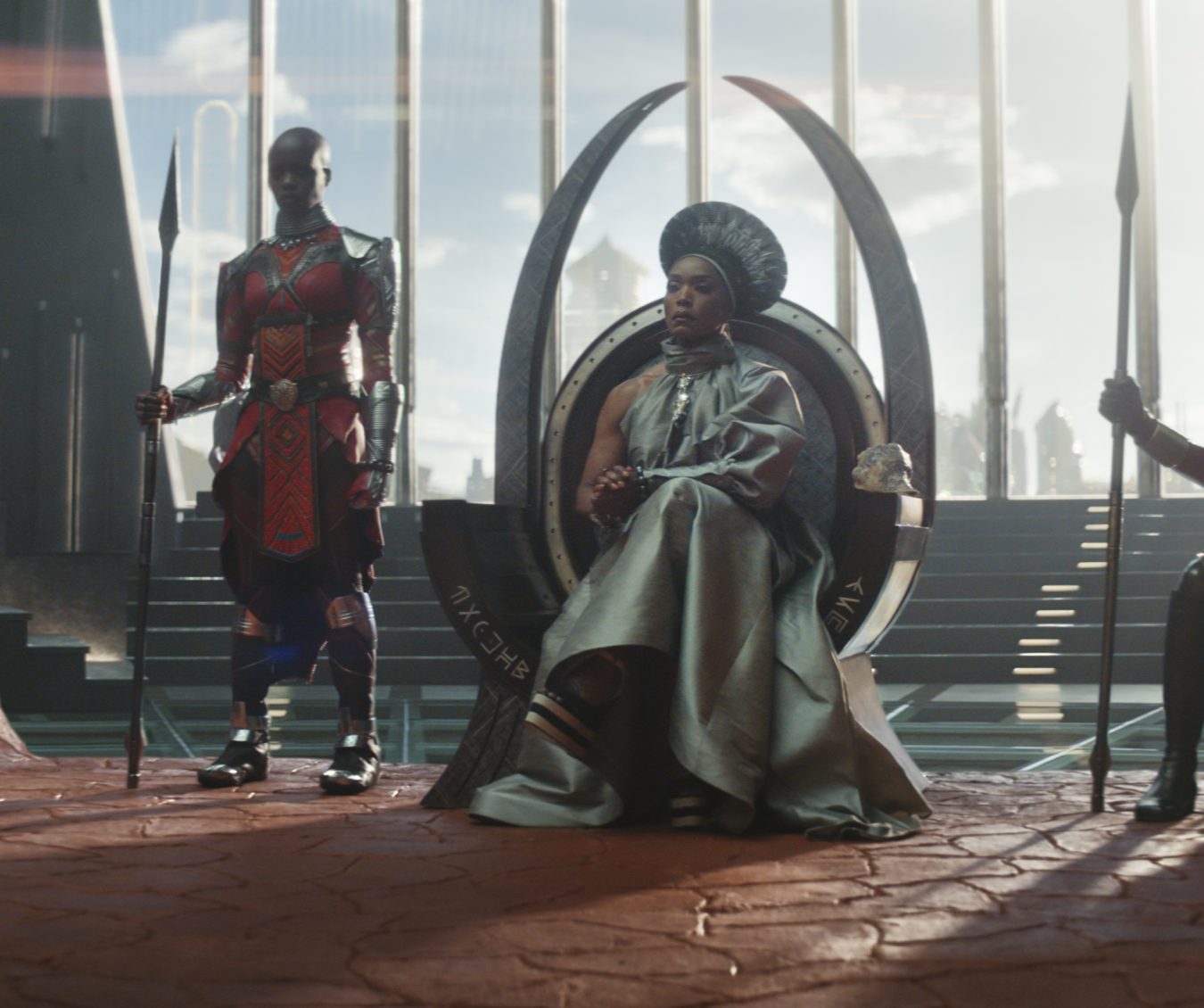 (L-R): Dorothy Steel as Merchant Tribe Elder, Florence Kasumba as Ayo, Angela Bassett as Ramonda, Danai Gurira as Okoye in Marvel Studios' Black Panther: Wakanda Forever. Photo courtesy of Marvel Studios. © 2022 MARVEL.
